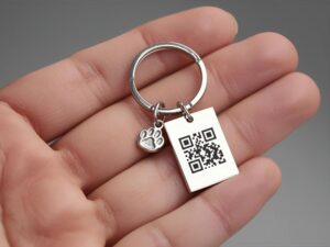 Hand holding a QR code keyring for a digital pet tribute, symbolising ways to celebrate your pet’s life online.